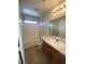 Clean bathroom with a tub-shower combo, single sink vanity, and a large mirror at 3748 Autumn King Ave, Henderson, NV 89052