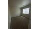This carpeted bedroom is illuminated by natural light streaming through a large window at 3748 Autumn King Ave, Henderson, NV 89052