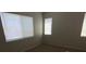 This bedroom offers plush carpeting, neutral walls, and natural light at 3748 Autumn King Ave, Henderson, NV 89052