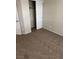 Bedroom with sliding closet doors and neutral carpeting at 3748 Autumn King Ave, Henderson, NV 89052