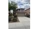 Traditional two-story home with a large driveway and a well-maintained front yard at 3748 Autumn King Ave, Henderson, NV 89052