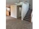 Carpeted living room open to the staircase at 3748 Autumn King Ave, Henderson, NV 89052