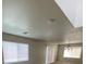 Bright living room featuring natural light, carpeted floors, and a chandelier at 3748 Autumn King Ave, Henderson, NV 89052