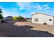 Spacious backyard with low-maintenance gravel landscaping, offering privacy with block wall enclosure at 3839 Dusty Glen Ct, North Las Vegas, NV 89032