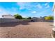 Expansive backyard with gravel ground cover, enclosed by block walls, ready for customization at 3839 Dusty Glen Ct, North Las Vegas, NV 89032