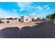 Low-maintenance backyard featuring gravel, privacy walls, and space for outdoor entertaining at 3839 Dusty Glen Ct, North Las Vegas, NV 89032