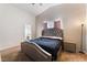 Bedroom featuring carpet, ensuite bathroom, and natural light at 3839 Dusty Glen Ct, North Las Vegas, NV 89032