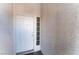 Close-up of the front door, showcasing the entry and textured exterior wall at 3839 Dusty Glen Ct, North Las Vegas, NV 89032