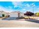 Charming single-story home featuring a two-car garage and a well-maintained front yard with a beautiful shade tree at 3839 Dusty Glen Ct, North Las Vegas, NV 89032