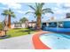 Backyard featuring a pool, artificial turf, and an outdoor seating area offers a perfect space for relaxation at 4406 Parkchester Cir, Las Vegas, NV 89108