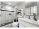 A stylish bathroom with a tiled shower, glass door, and modern fixtures offers a spa-like experience at 4406 Parkchester Cir, Las Vegas, NV 89108