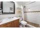 Nicely updated bathroom featuring tiled shower, modern vanity and large mirror at 4406 Parkchester Cir, Las Vegas, NV 89108