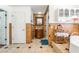 This bathroom features unique tiles, a wood vanity, and shelving for storage at 4406 Parkchester Cir, Las Vegas, NV 89108