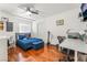 Inviting bedroom with hardwood floors and a large window for natural light at 4406 Parkchester Cir, Las Vegas, NV 89108