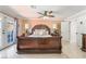 This elegant bedroom features natural light, tile floors, and a ceiling fan for added comfort at 4406 Parkchester Cir, Las Vegas, NV 89108