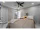 A well-lit bedroom featuring modern décor, and access to an ensuite bathroom, offers comfort and style at 4406 Parkchester Cir, Las Vegas, NV 89108