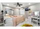 This bedroom offers a ceiling fan, decorative sunflowers, and a makeup vanity with lighting at 4406 Parkchester Cir, Las Vegas, NV 89108