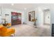 Bright foyer featuring tile floors, a large mirror, and double wood doors at 4406 Parkchester Cir, Las Vegas, NV 89108