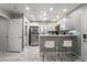 Modern kitchen with stainless steel appliances, white cabinets, and ample countertop space at 4406 Parkchester Cir, Las Vegas, NV 89108