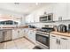 Bright kitchen featuring stainless steel appliances and ample countertop space at 4406 Parkchester Cir, Las Vegas, NV 89108