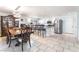 Bright kitchen and dining area with stainless steel appliances, and tile flooring at 4406 Parkchester Cir, Las Vegas, NV 89108