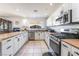 Charming kitchen featuring stainless steel appliances, light cabinets, and ample counter space at 4406 Parkchester Cir, Las Vegas, NV 89108