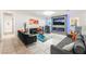 Spacious living room with modern furniture, tile floors, and a sleek fireplace at 4406 Parkchester Cir, Las Vegas, NV 89108
