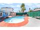 A backyard features a sparkling pool and patio seating for outdoor enjoyment, perfect for gatherings and relaxation at 4406 Parkchester Cir, Las Vegas, NV 89108
