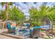 Cozy backyard lounge with comfortable seating, a grill, and a charming hanging chair at 4419 Via Bianca Ave, Las Vegas, NV 89141