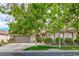 Charming single-story home exterior with mature trees and manicured landscaping at 4419 Via Bianca Ave, Las Vegas, NV 89141