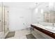 Bright bathroom with double sink vanity, modern fixtures, and marble shower at 4471 Dean Martin Dr # 1502, Las Vegas, NV 89103