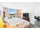 Bright bedroom with large window, city views, hardwood floors, and a flatscreen television at 4471 Dean Martin Dr # 1502, Las Vegas, NV 89103
