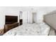 Bedroom featuring a flatscreen tv, neutral colors, and easy access to both the bathroom and kitchen at 4471 Dean Martin Dr # 1502, Las Vegas, NV 89103
