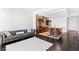 Open-concept space with a leather sofa flowing into a modern kitchen with an island at 4471 Dean Martin Dr # 1502, Las Vegas, NV 89103