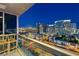 Balcony view overlooking the city with two wicker chairs, a metal railing and glass windows at 4575 Dean Martin Dr # 2701, Las Vegas, NV 89103