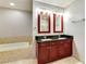 This bathroom offers dual sinks and a luxurious soaking tub at 4575 Dean Martin Dr # 2701, Las Vegas, NV 89103