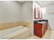 This bathroom offers dual sinks and a luxurious soaking tub at 4575 Dean Martin Dr # 2701, Las Vegas, NV 89103