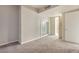 Spacious bedroom features soft carpeting, a sliding door closet, and access to the ensuite bathroom at 4575 Dean Martin Dr # 2701, Las Vegas, NV 89103