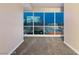 Serene bedroom with plush carpeting and expansive windows showcasing a breathtaking cityscape at 4575 Dean Martin Dr # 2701, Las Vegas, NV 89103