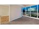 Cozy bedroom with carpet floors, large windows offering city views, and access to a bathroom at 4575 Dean Martin Dr # 2701, Las Vegas, NV 89103