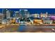Bright cityscape view featuring several illuminated buildings and roadways during nighttime at 4575 Dean Martin Dr # 2701, Las Vegas, NV 89103