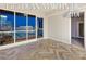 Bright living room featuring wood-patterned floors, large windows, and amazing city views at 4575 Dean Martin Dr # 2701, Las Vegas, NV 89103