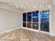 Spacious living room featuring wood-patterned floors, large windows, and beautiful city views at 4575 Dean Martin Dr # 2701, Las Vegas, NV 89103