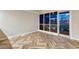 Bright living room featuring herringbone-patterned floors, large windows, and a city view at night at 4575 Dean Martin Dr # 2701, Las Vegas, NV 89103
