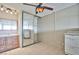 Bedroom featuring a ceiling fan, mirrored sliding closet doors, and a vanity sink at 4600 University Center Dr # 175, Las Vegas, NV 89119
