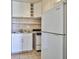 Compact kitchen featuring white appliances, a sink and basic cooking essentials at 4600 University Center Dr # 175, Las Vegas, NV 89119