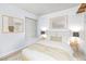 Serene bedroom with white walls, wood floors, neutral decor, and a comfortable, inviting atmosphere at 4614 Grand Dr # 1, Las Vegas, NV 89169