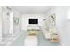 Bright and airy living room with neutral tones, tile floors and contemporary decor and entertainment center at 4614 Grand Dr # 1, Las Vegas, NV 89169