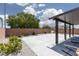 Spacious backyard patio featuring desert landscaping and a brick privacy wall at 5136 Stonecrop St, North Las Vegas, NV 89031