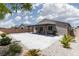 Spacious backyard patio with a pergola, built-in BBQ and desert landscaping at 5136 Stonecrop St, North Las Vegas, NV 89031